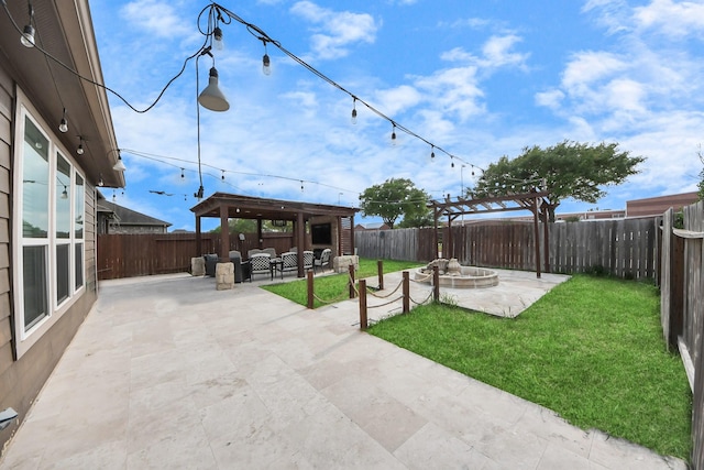 view of yard featuring a fenced backyard, a patio area, an outdoor fire pit, and a gazebo