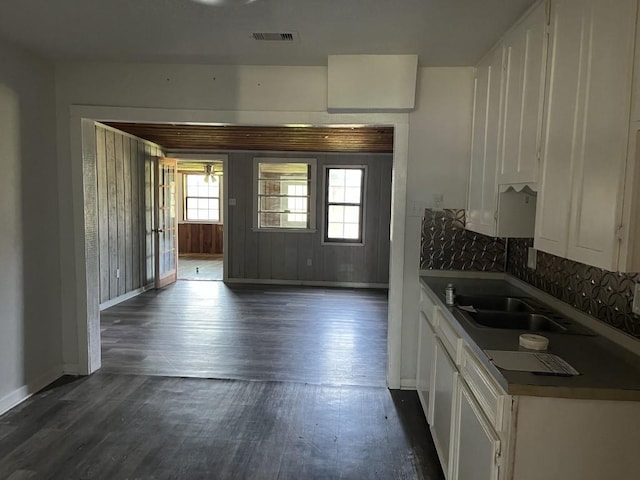 749 Lorrain St, Angleton, TX 77515 - kitchen featuring dark wood-style floors, a sink, white cabinetry, and visible vents