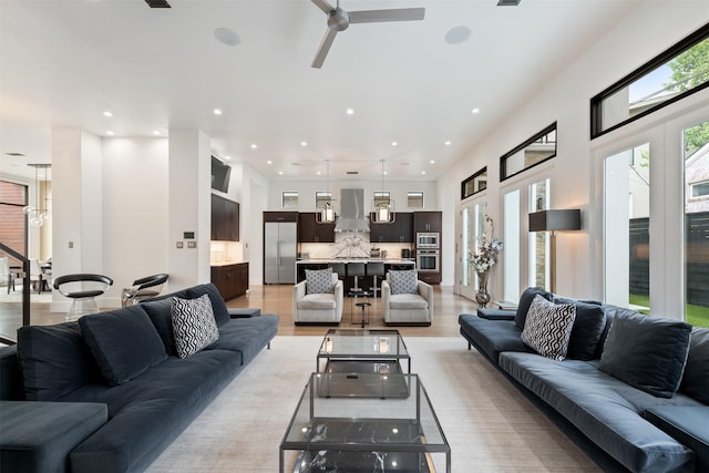 2703 Westgrove Ln, Houston, TX 77027 - living area featuring recessed lighting, light wood-type flooring, and a ceiling fan