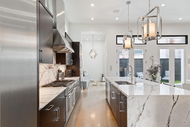 2703 Westgrove Ln, Houston, TX 77027 - kitchen featuring a large island with sink, a sink, dark brown cabinetry, high end appliances, and modern cabinets