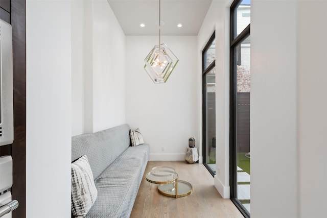 2703 Westgrove Ln, Houston, TX 77027 - living room with recessed lighting, baseboards, a notable chandelier, and light wood-style flooring