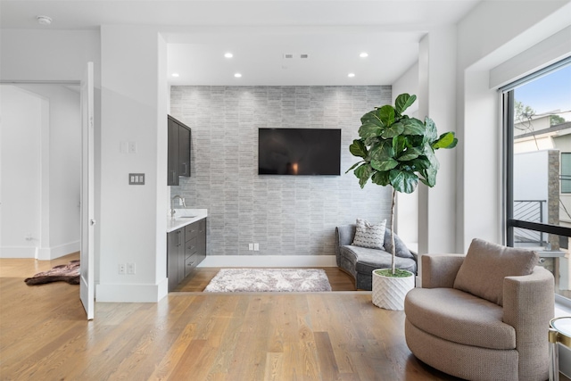 2703 Westgrove Ln, Houston, TX 77027 - living area featuring light wood-type flooring, baseboards, recessed lighting, and visible vents