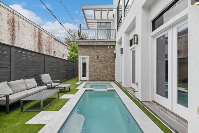 2703 Westgrove Ln, Houston, TX 77027 - view of swimming pool featuring a lawn, a fenced backyard, outdoor lounge area, and a pool with connected hot tub