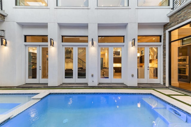 2703 Westgrove Ln, Houston, TX 77027 - view of pool with french doors and a pool with connected hot tub