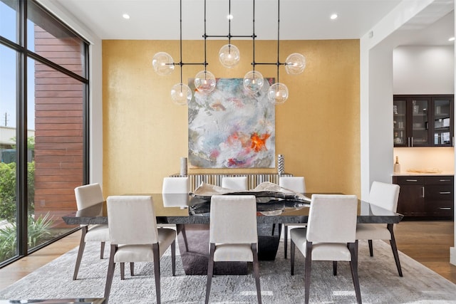 2703 Westgrove Ln, Houston, TX 77027 - dining room with recessed lighting, wood finished floors, and floor to ceiling windows
