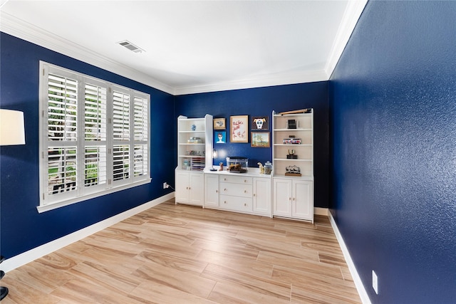 interior space with baseboards, visible vents, light wood-style floors, and ornamental molding