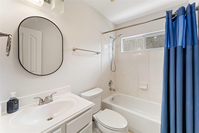 bathroom featuring shower / tub combo with curtain, toilet, and vanity