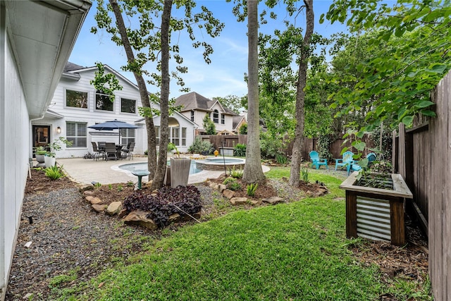 view of yard with a patio area and a fenced backyard