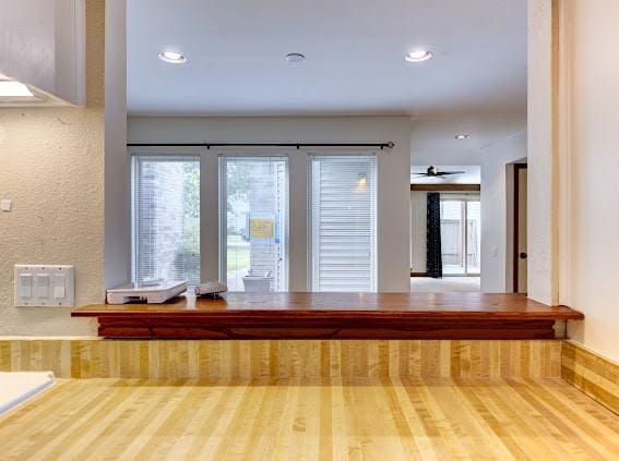 interior space with a ceiling fan and recessed lighting