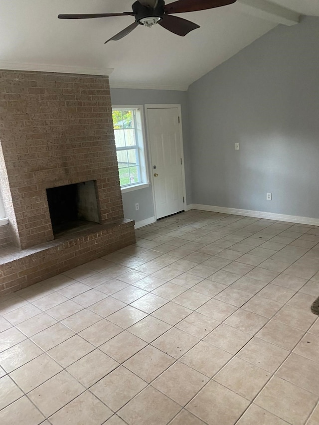 14418 Alkay St, Houston, TX 77045 - unfurnished living room with light tile patterned floors, baseboards, a brick fireplace, a ceiling fan, and vaulted ceiling with beams