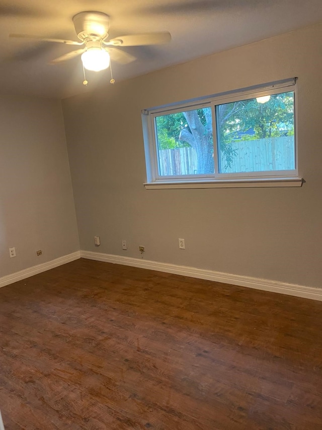 14418 Alkay St, Houston, TX 77045 - empty room featuring baseboards, a ceiling fan, and dark wood-style flooring