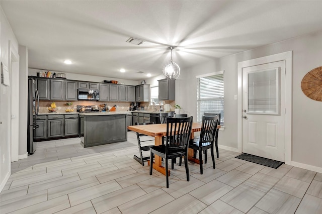 dining room featuring recessed lighting, visible vents, and baseboards