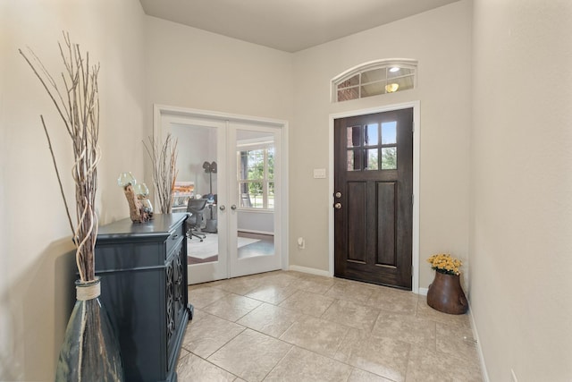 3639 Daintree Park Dr, Katy, TX 77494 - foyer featuring french doors, baseboards, and light tile patterned flooring