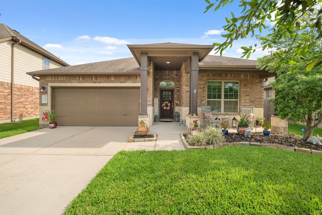 3639 Daintree Park Dr, Katy, TX 77494 - view of front of house featuring brick siding, an attached garage, driveway, a front yard, and roof with shingles