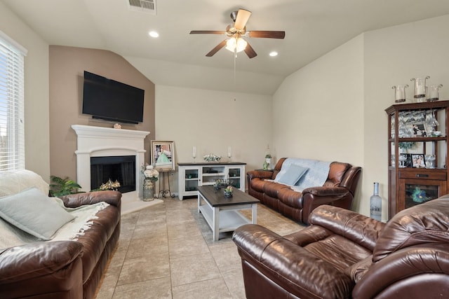 3639 Daintree Park Dr, Katy, TX 77494 - living room with lofted ceiling, ceiling fan, a fireplace with raised hearth, and recessed lighting