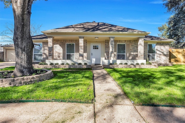 7810 Blackjack Ct, Houston, TX 77088 - view of front of property with a shingled roof, covered porch, brick siding, and a front yard