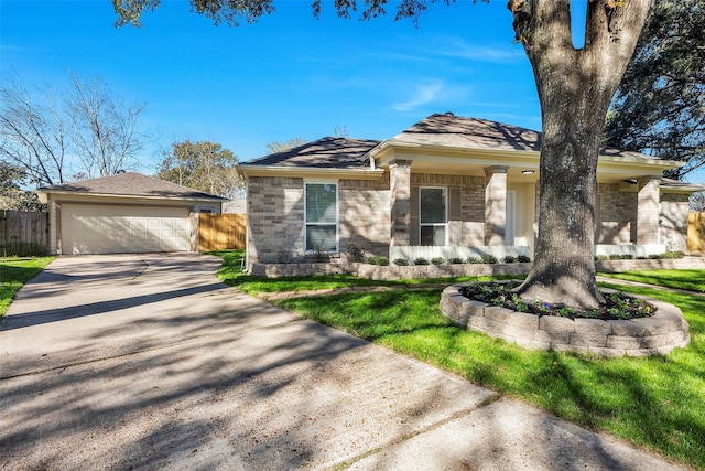 7810 Blackjack Ct, Houston, TX 77088 - view of front of home featuring fence, stone siding, and driveway