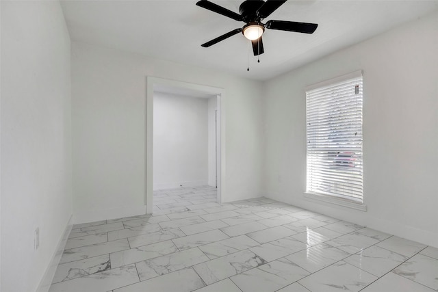 7810 Blackjack Ct, Houston, TX 77088 - empty room featuring marble finish floor, baseboards, and ceiling fan
