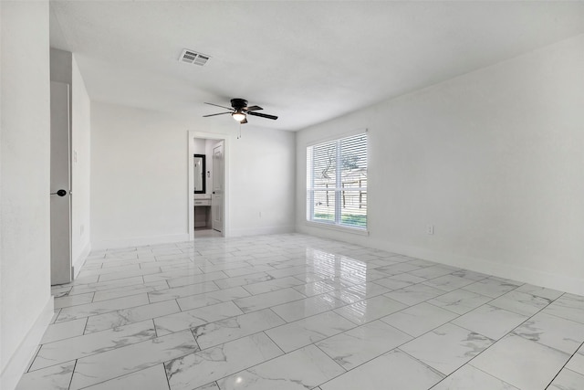 7810 Blackjack Ct, Houston, TX 77088 - unfurnished room with baseboards, visible vents, marble finish floor, and ceiling fan