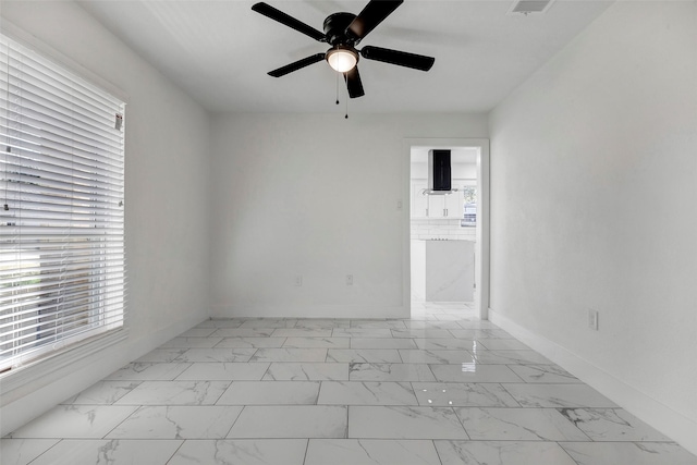 7810 Blackjack Ct, Houston, TX 77088 - unfurnished room with marble finish floor, baseboards, and ceiling fan