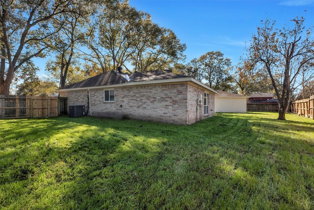 7810 Blackjack Ct, Houston, TX 77088 - back of house with a fenced backyard, brick siding, a yard, and cooling unit