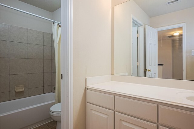 bathroom with shower / bath combination with curtain, vanity, visible vents, and toilet