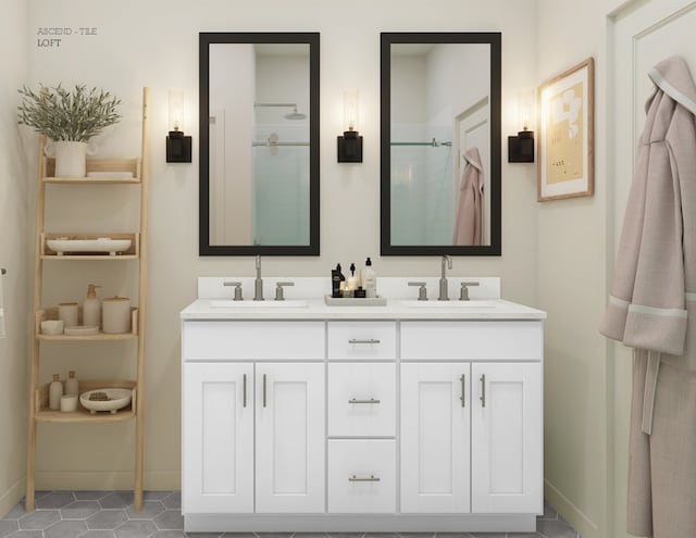 full bath featuring walk in shower, baseboards, a sink, and double vanity