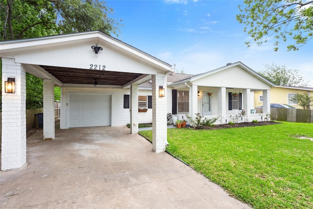 view of front of property with concrete driveway, a garage, and a carport