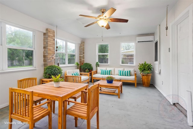 sunroom / solarium featuring a wall mounted AC