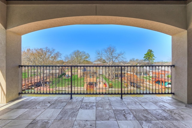view of patio featuring a balcony