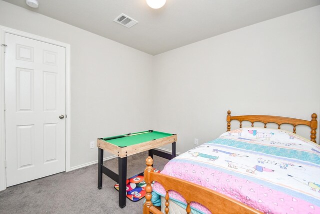 bedroom featuring carpet floors, visible vents, and baseboards