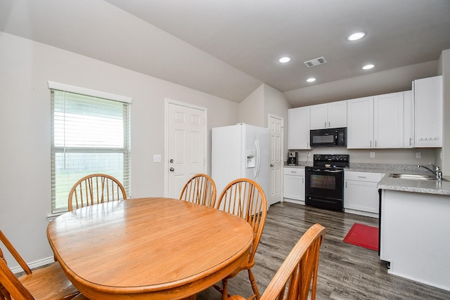 dining room with vaulted ceiling, baseboards, dark wood-style flooring, visible vents, and recessed lighting
