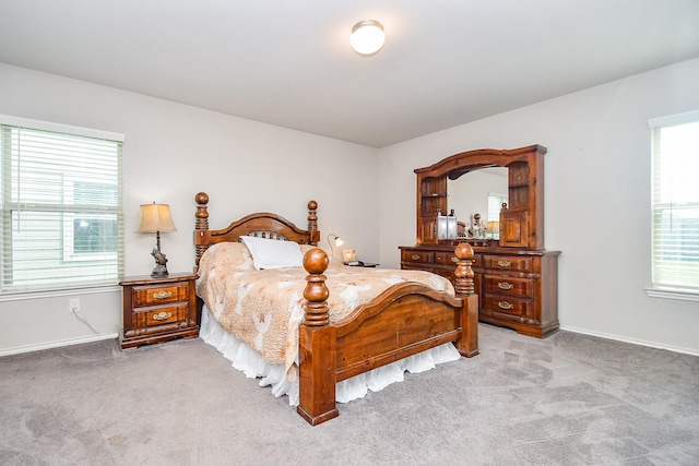 bedroom featuring baseboards and carpet floors