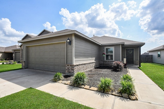 ranch-style home featuring driveway, an attached garage, fence, a front yard, and brick siding
