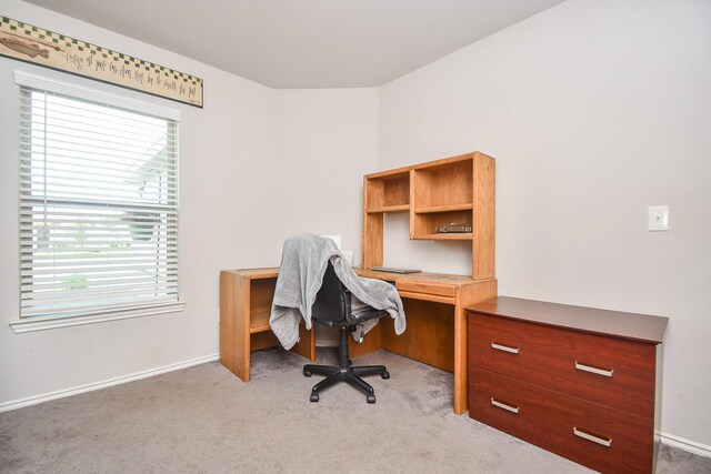 office with light carpet and baseboards