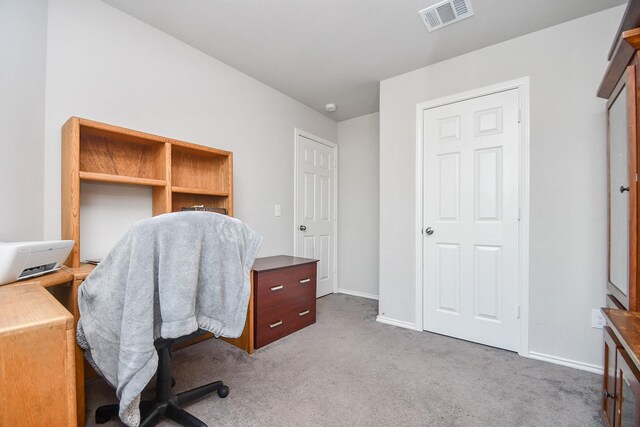 office space with baseboards, carpet flooring, and visible vents