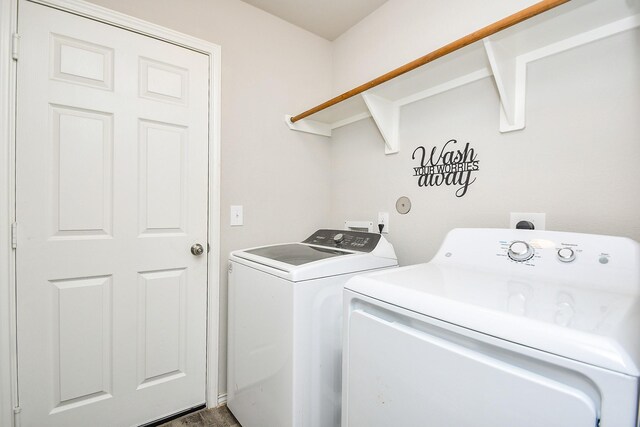 washroom with washer and clothes dryer and laundry area