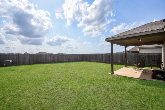view of yard with a fenced backyard and a patio area