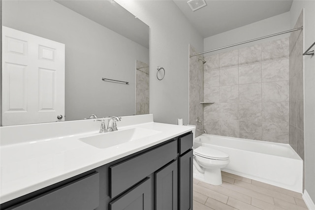 269 Bay Oaks Dr, La Porte, TX 77571 - full bathroom featuring visible vents, toilet, vanity, and bathtub / shower combination