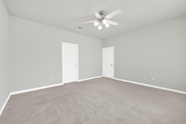 269 Bay Oaks Dr, La Porte, TX 77571 - spare room with dark colored carpet, visible vents, baseboards, and ceiling fan