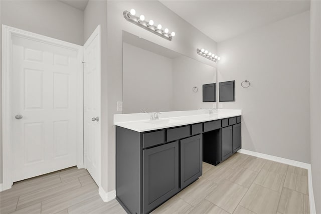 269 Bay Oaks Dr, La Porte, TX 77571 - bathroom with baseboards, a sink, and double vanity