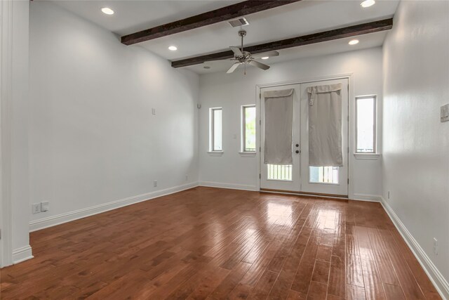 611 Mazal Ln, Houston, TX 77009 - interior space featuring beamed ceiling, wood finished floors, a healthy amount of sunlight, and visible vents