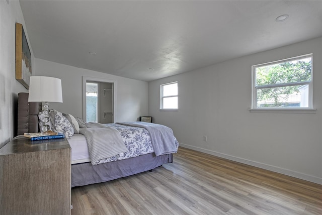 4716 Siegel St, Houston, TX 77009 - bedroom featuring baseboards and light wood-style floors