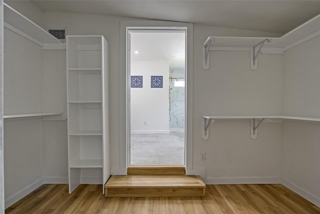 4716 Siegel St, Houston, TX 77009 - spacious closet featuring visible vents and wood finished floors
