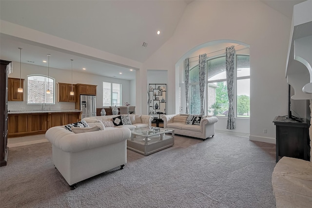 living room featuring visible vents, carpet flooring, recessed lighting, and high vaulted ceiling
