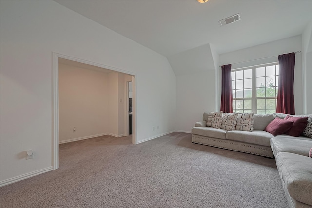 living room with baseboards, lofted ceiling, visible vents, and carpet floors