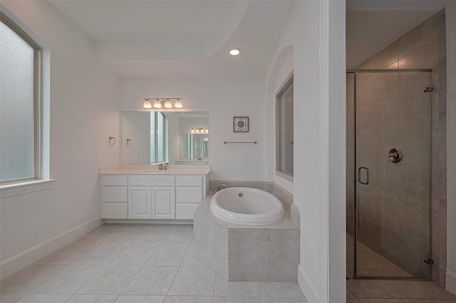 bathroom with a bath, tile patterned flooring, and a stall shower