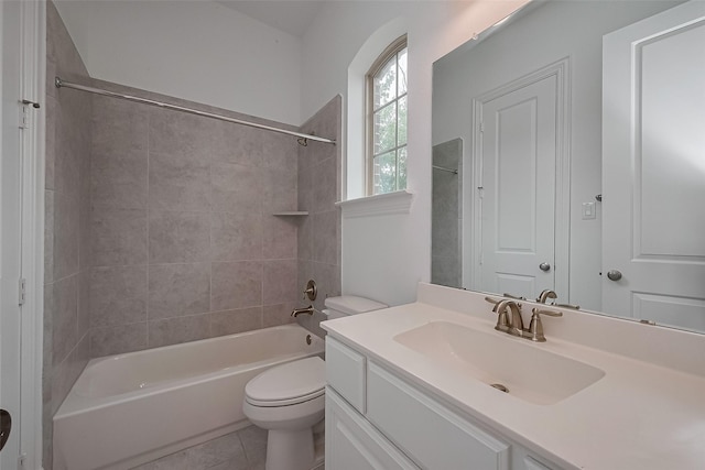 bathroom with washtub / shower combination, toilet, vanity, and tile patterned floors