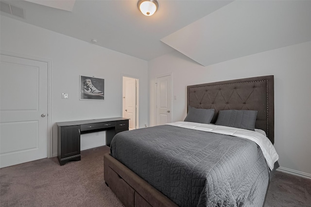 carpeted bedroom featuring baseboards and visible vents