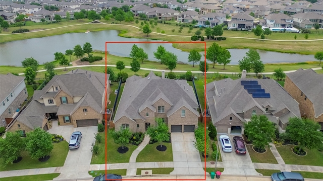 birds eye view of property with a residential view and a water view